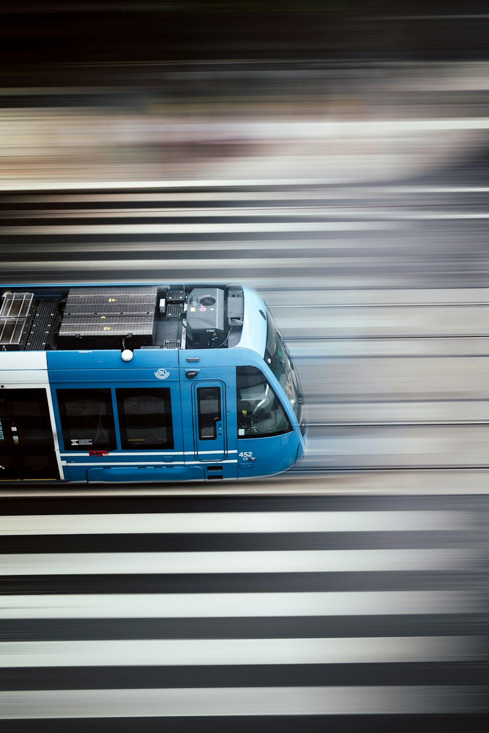 blue and white train in a tunnel