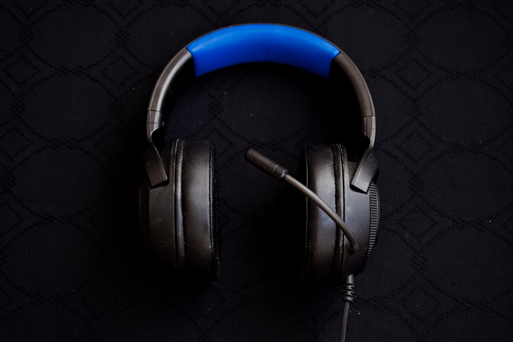 black and blue corded headphones