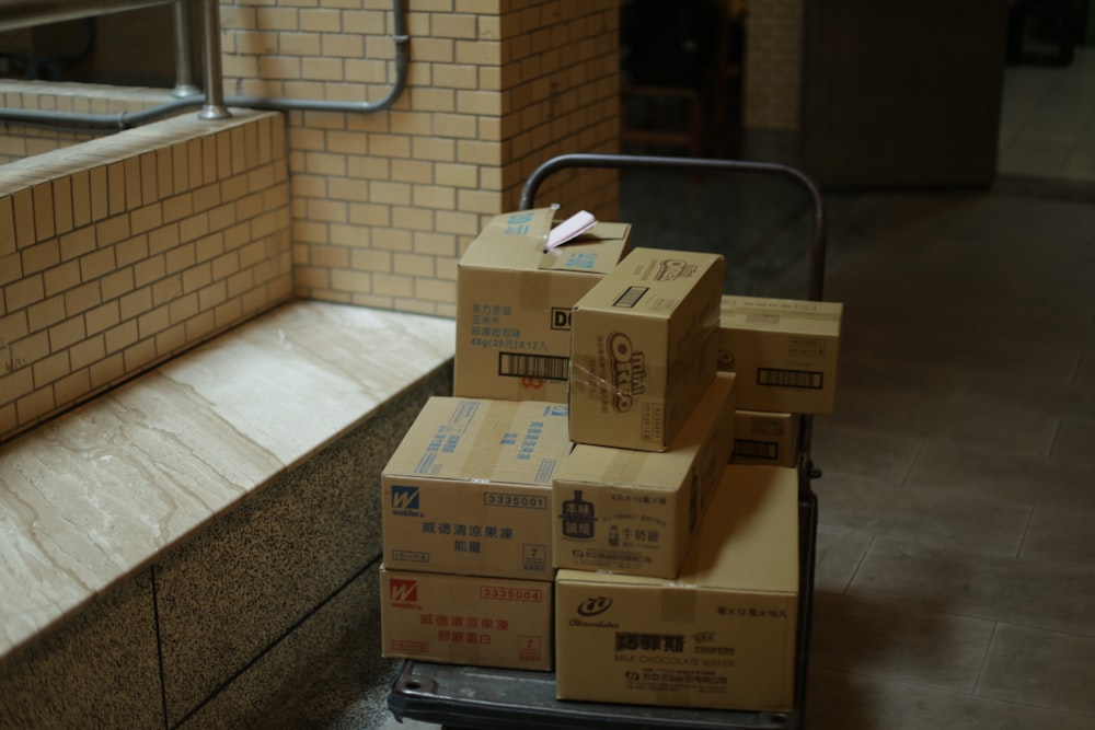 brown cardboard boxes on gray metal rack