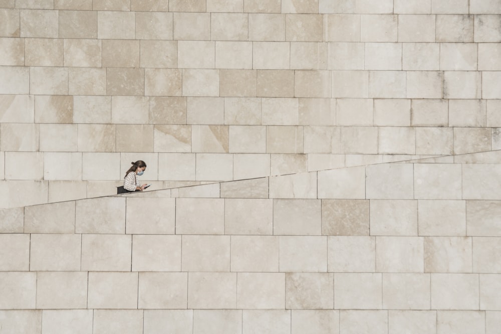 2 person lying on white ceramic tiles