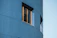Close-up of a freshly restored building facade with clean, modern finishes.