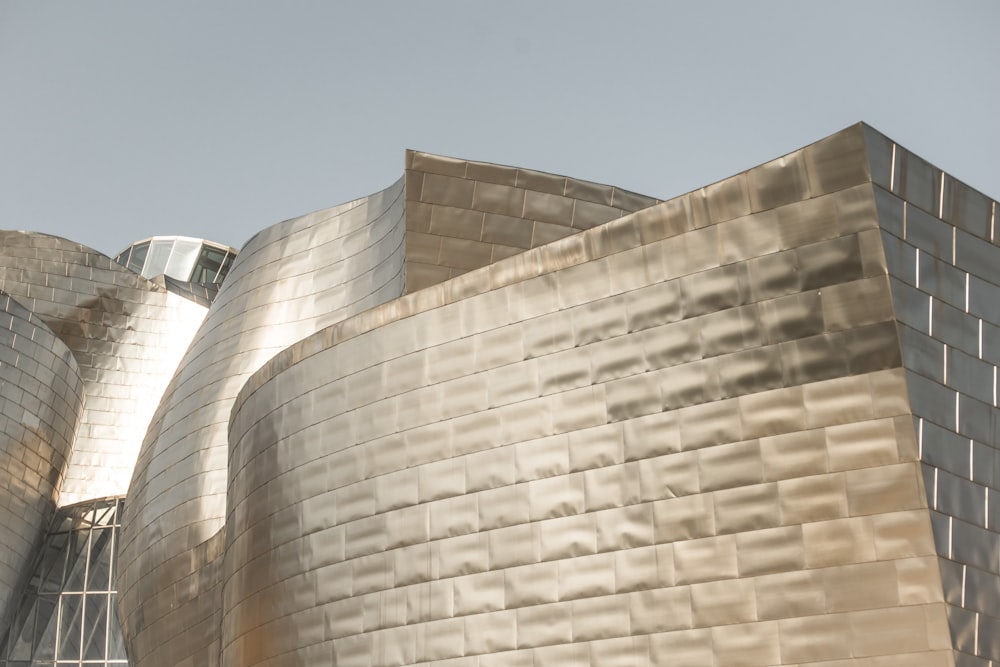 white van parked beside beige concrete building during daytime