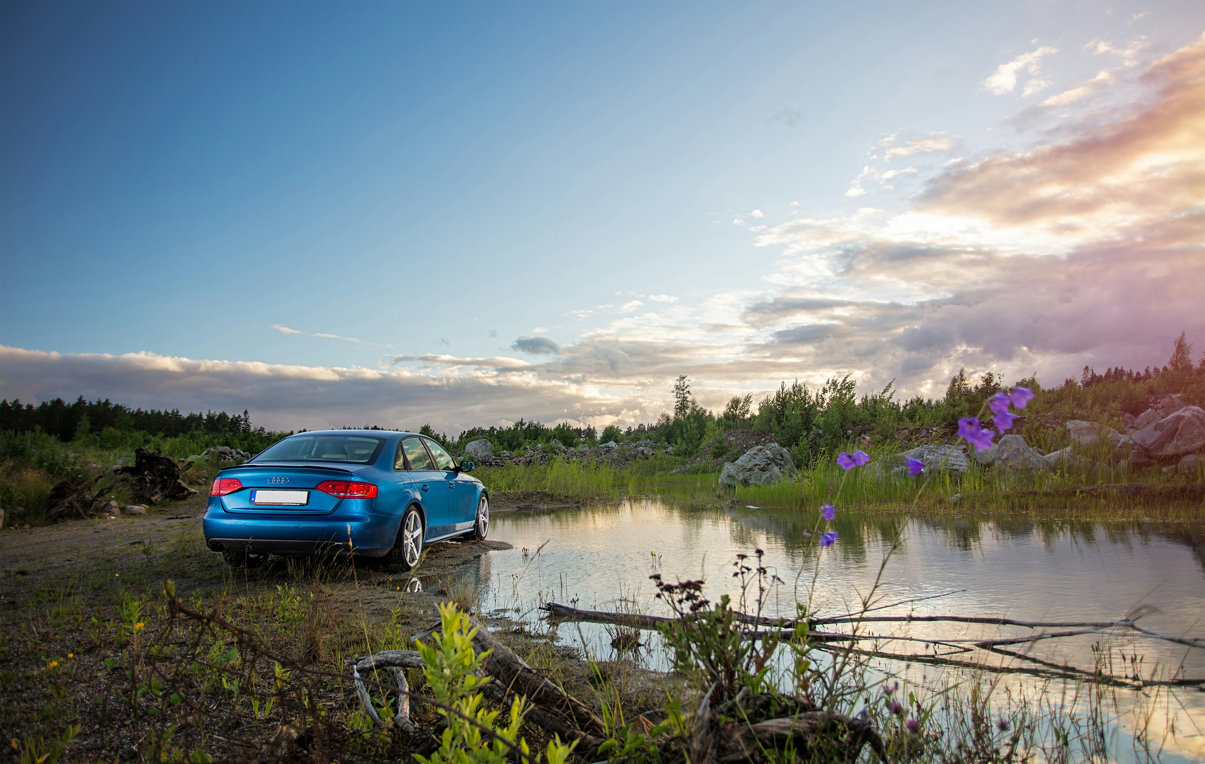 Blue Audi A4 Quattro Saloon Scene with Swedish landscape.