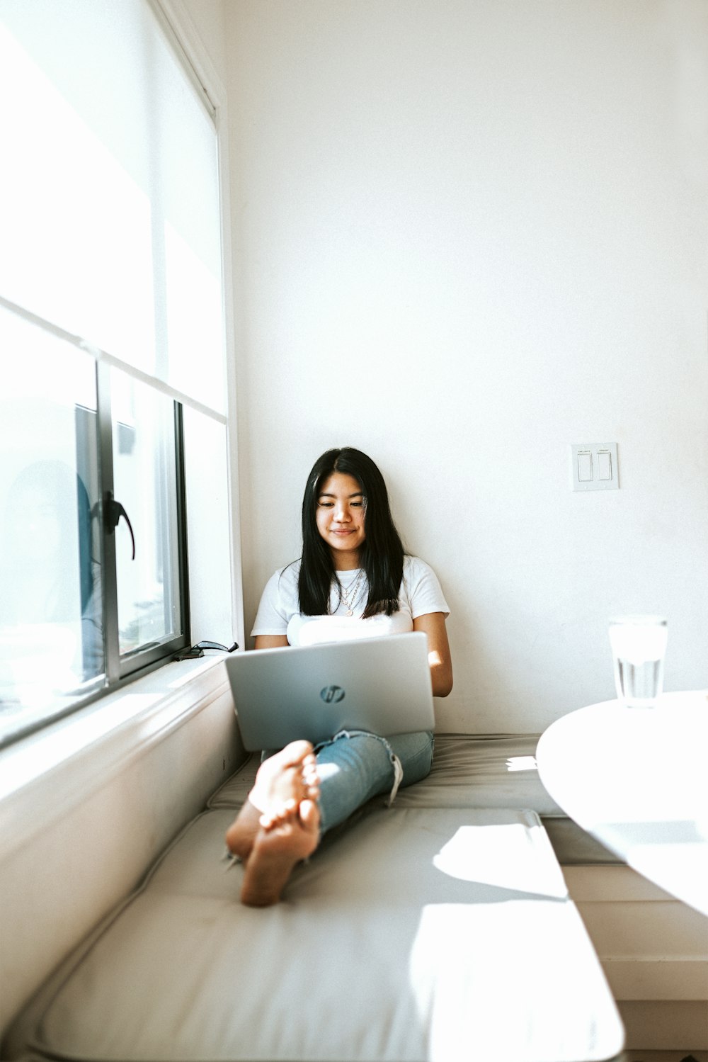 woman in black shirt using laptop