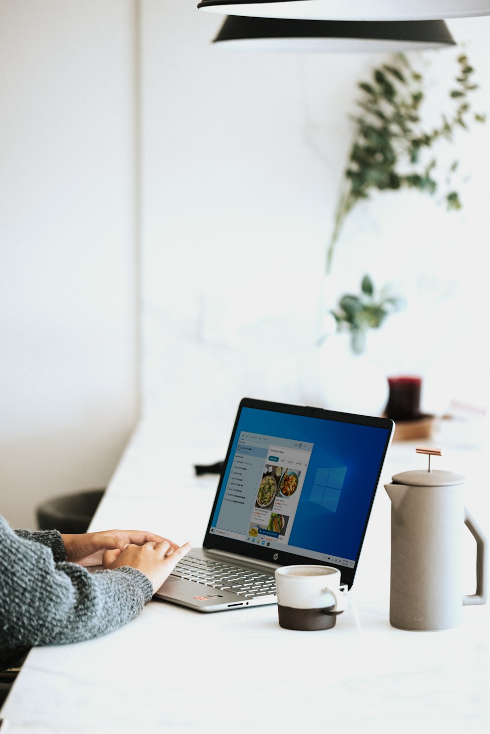 person using laptop on table