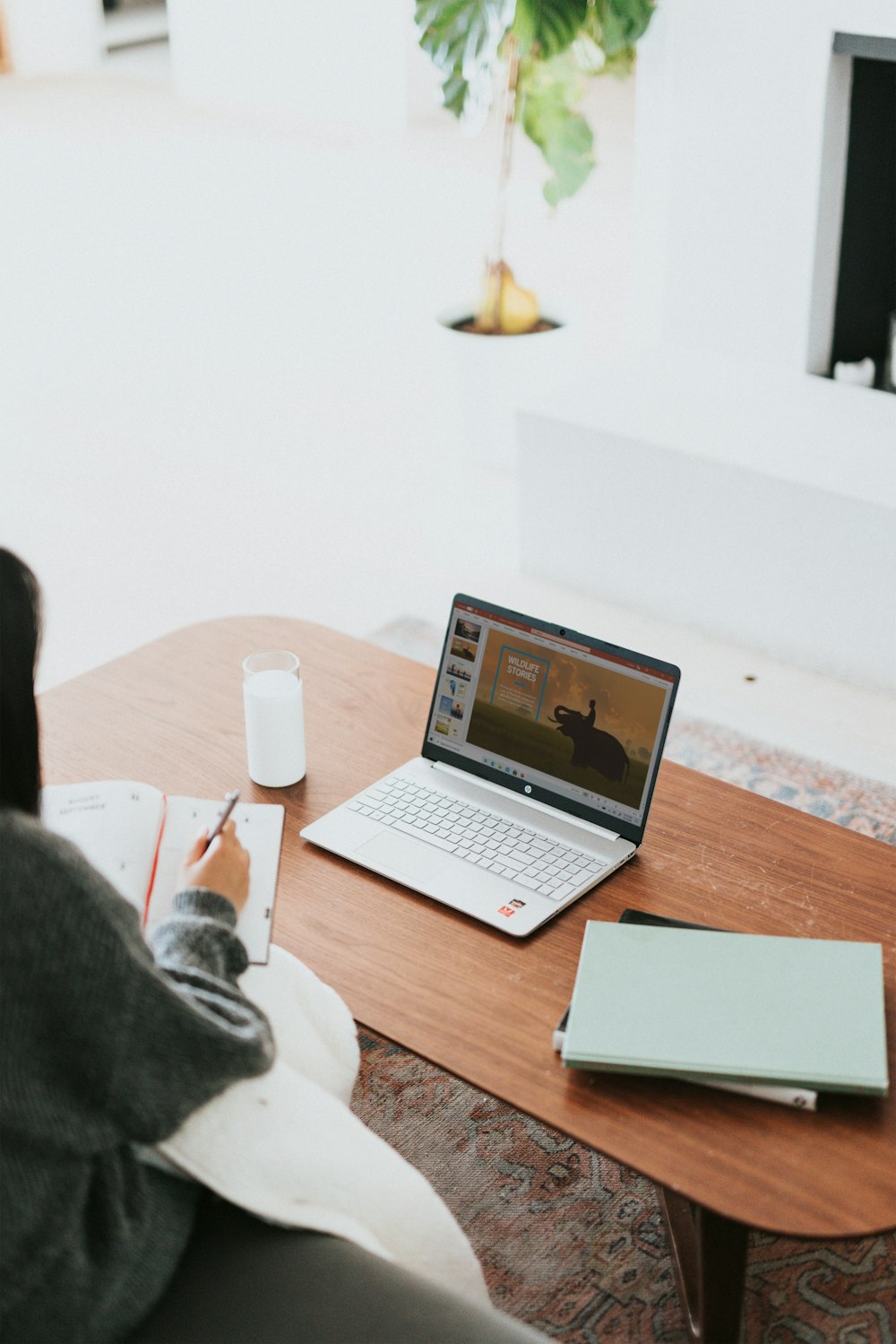 laptop on brown wooden table