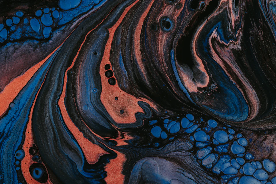 Abstract painting with chaotic yet harmonious blend of blue and orange hues in frame