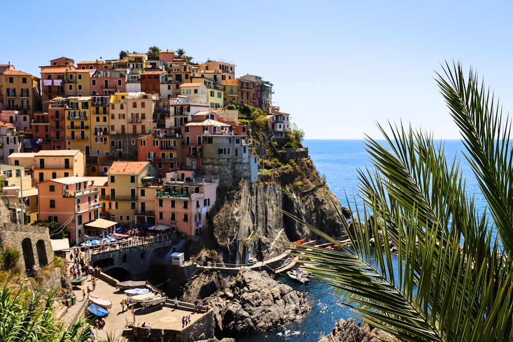 a village on a cliff overlooking the ocean