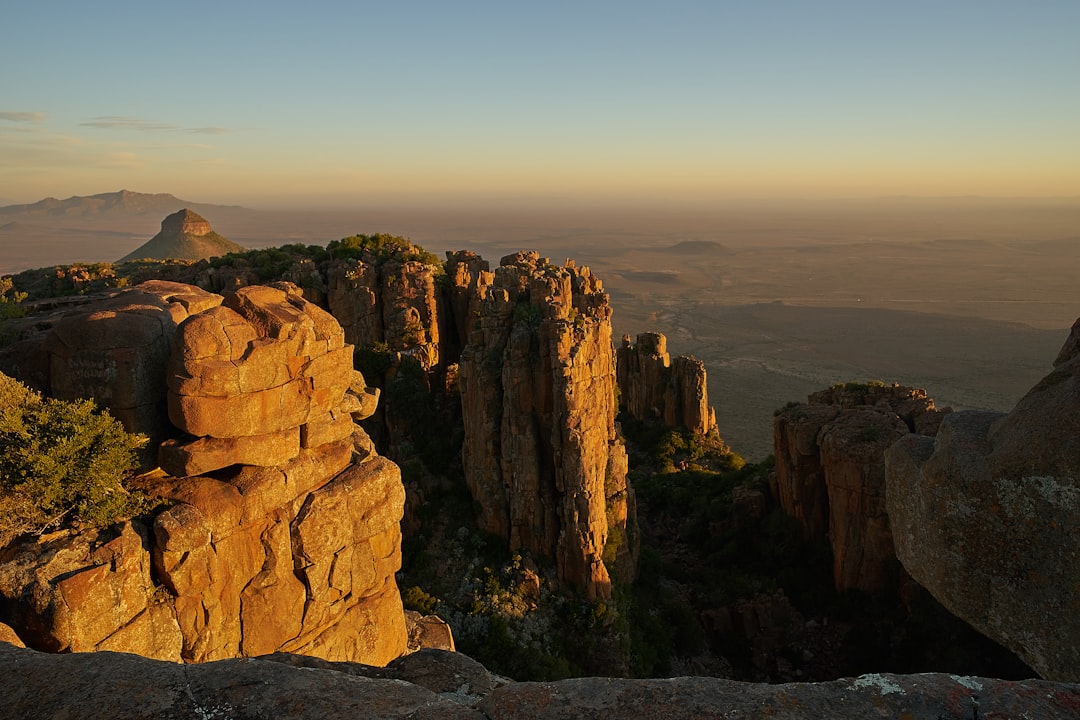 brown rock formation under blue sky during daytime