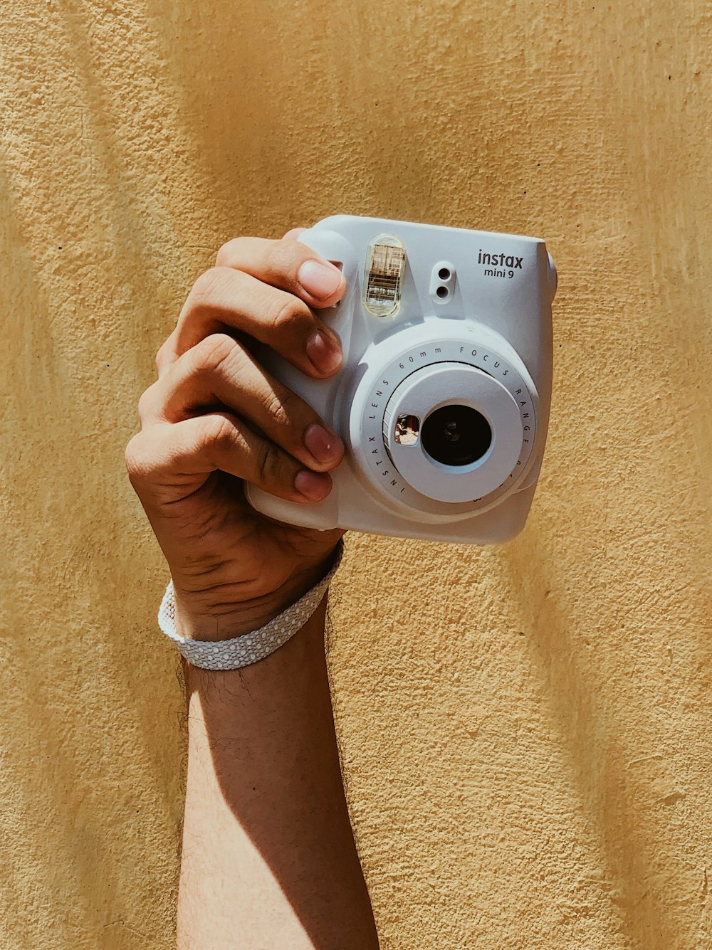 person holding white canon camera
