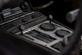 Close-up of a golf cart dashboard showing repaired controls and gauges.