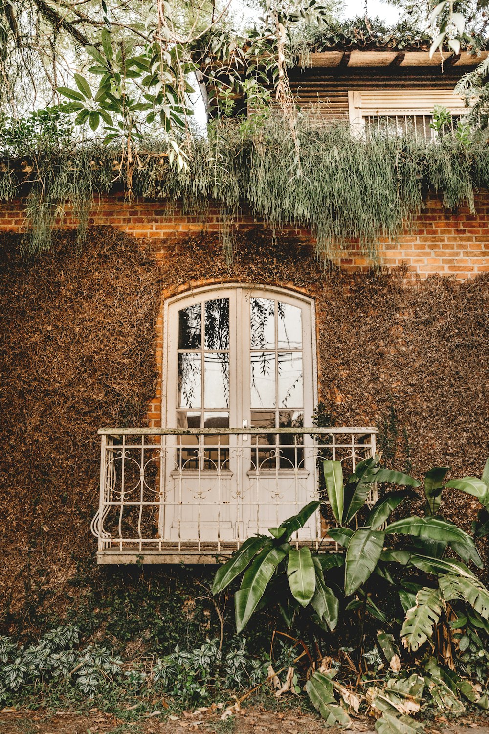 white wooden window frame on brown concrete wall