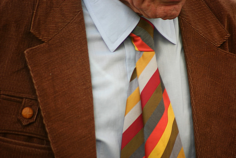 man in brown suit jacket