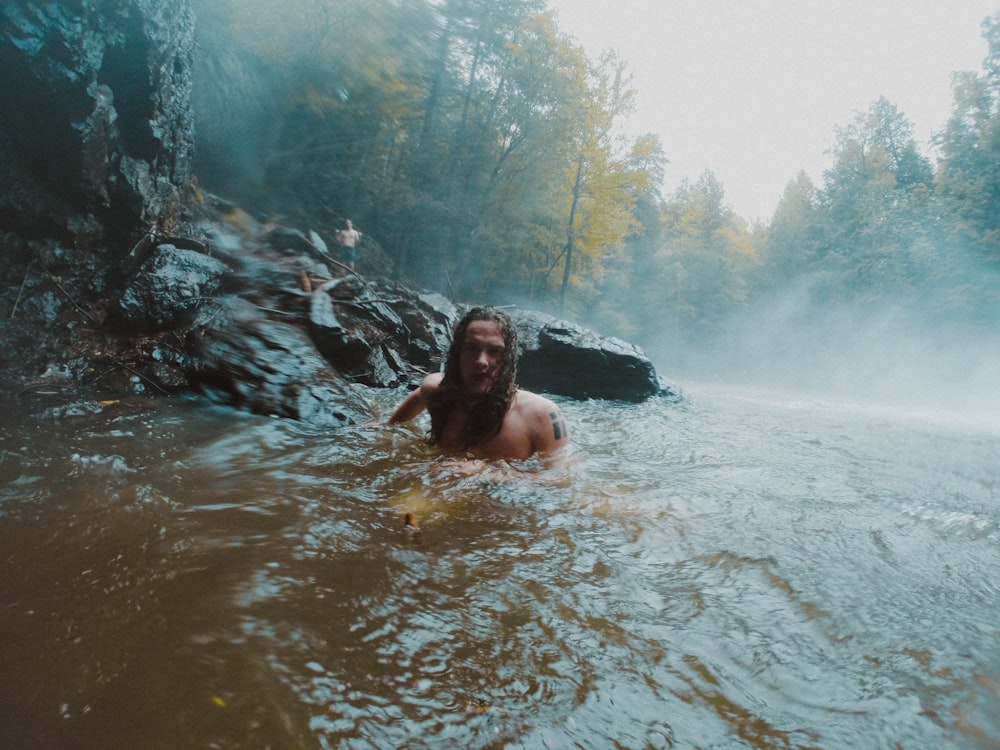 man in water during daytime