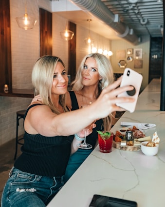 woman in black tank top holding agency onlyfans
