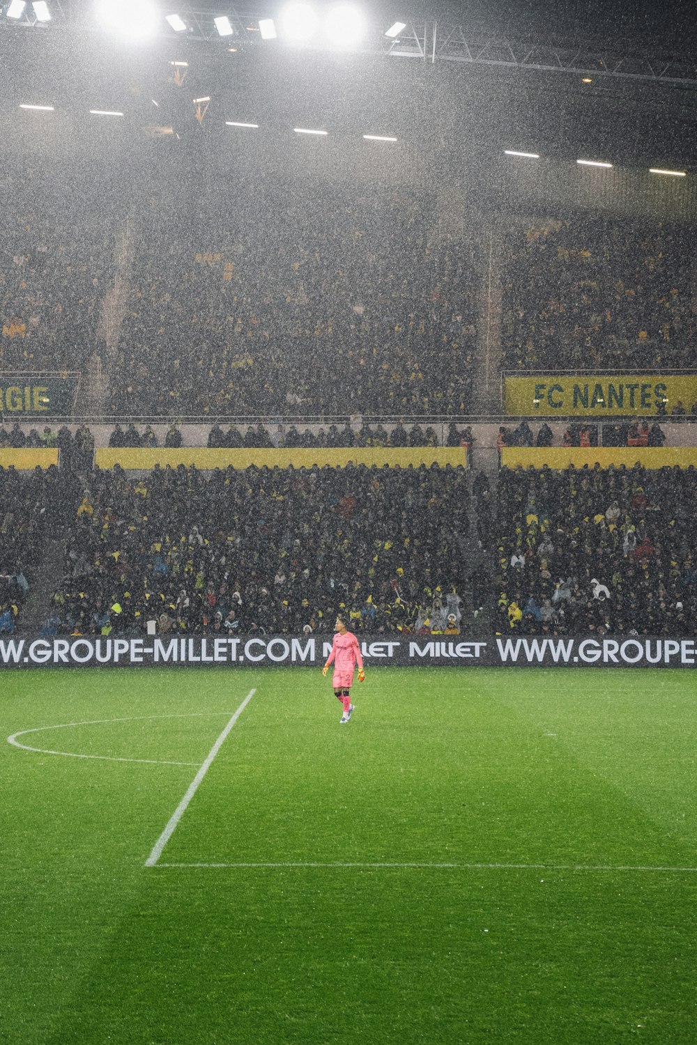 soccer players on field during daytime