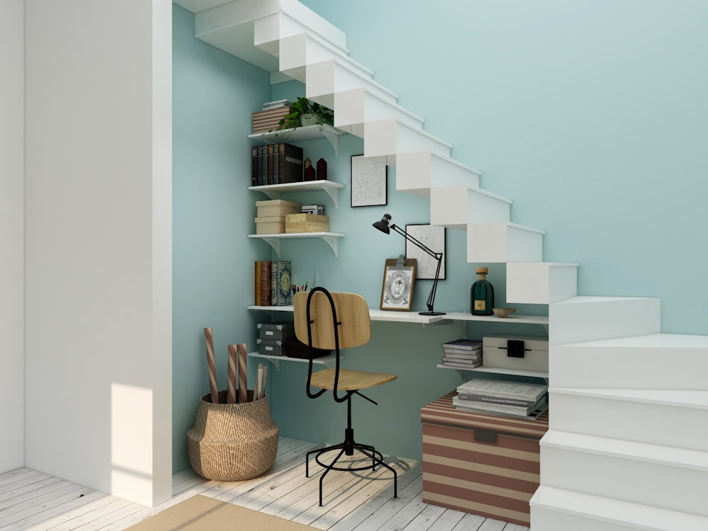 black metal framed brown padded chair beside white wooden shelf