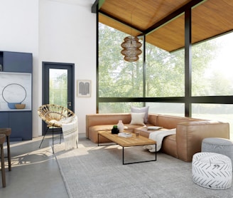 living room with brown sofa and glass window