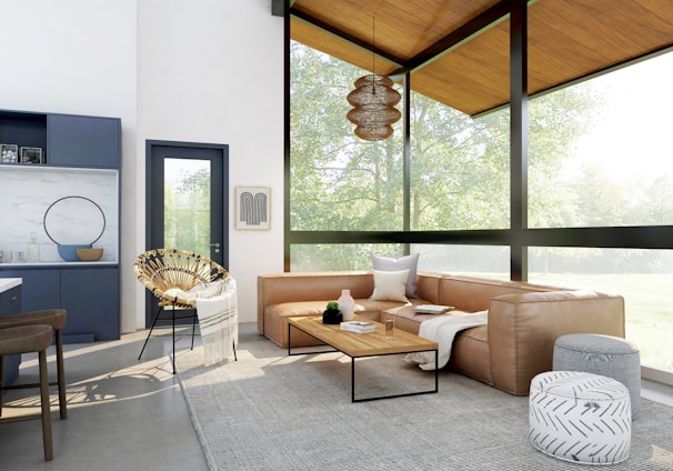 living room with brown sofa and glass window