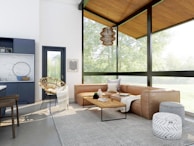 living room with brown sofa and glass window