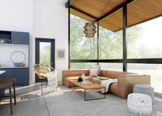 living room with brown sofa and glass window