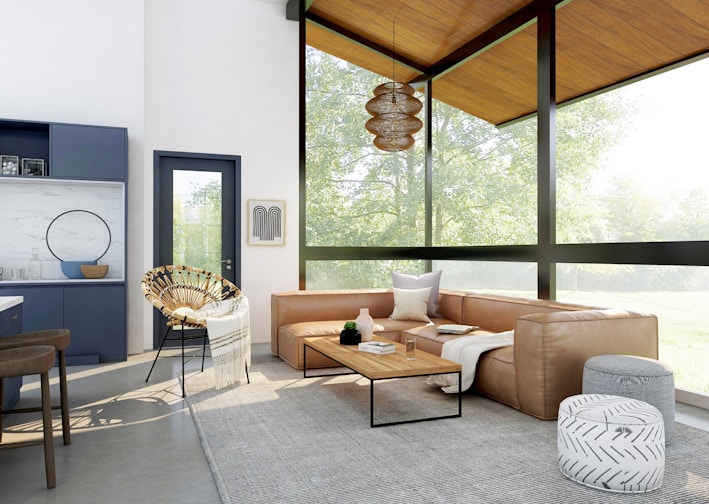 living room with brown sofa and glass window