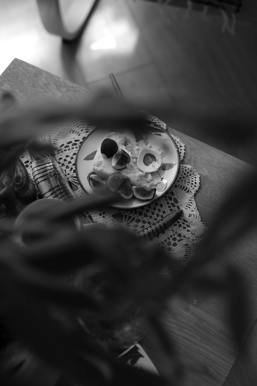 grayscale photo of person holding skull