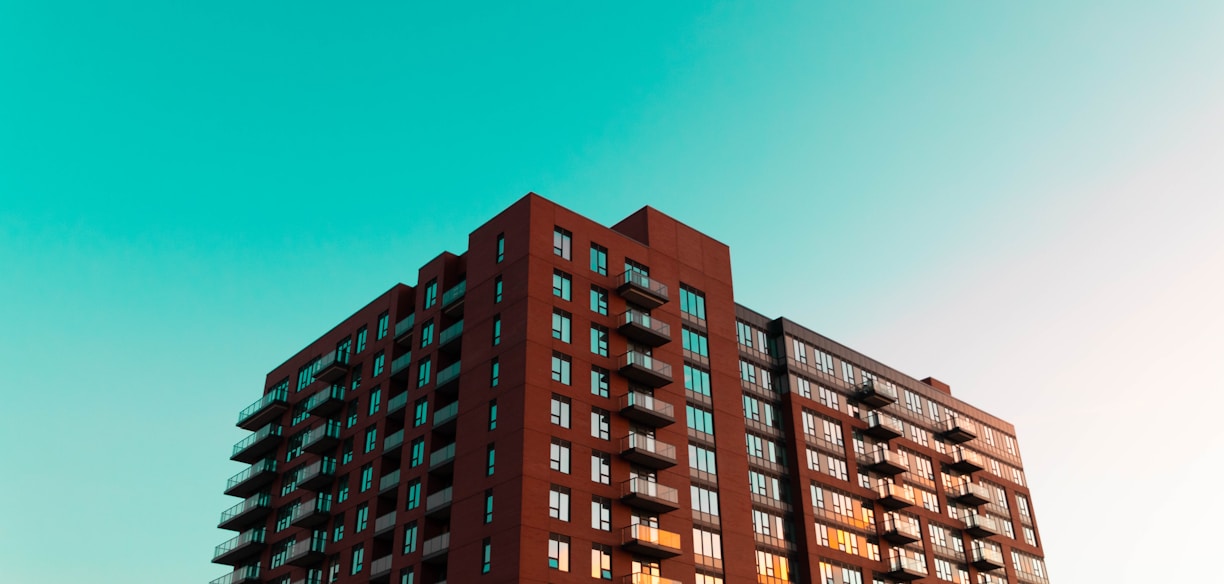 brown concrete building under blue sky during daytime