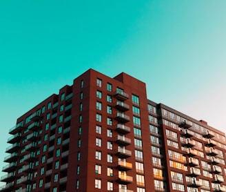 brown concrete building under blue sky during daytime