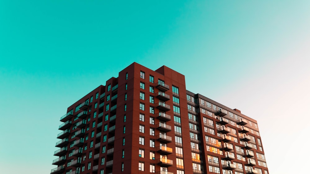 brown concrete building under blue sky during daytime