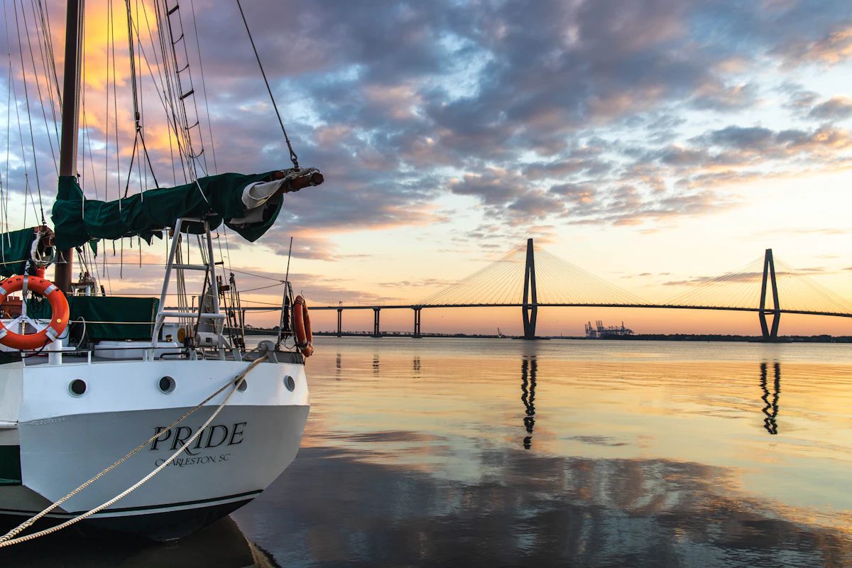 Sailboat docked in Charleston harbor with the Ravenel Bridge behind