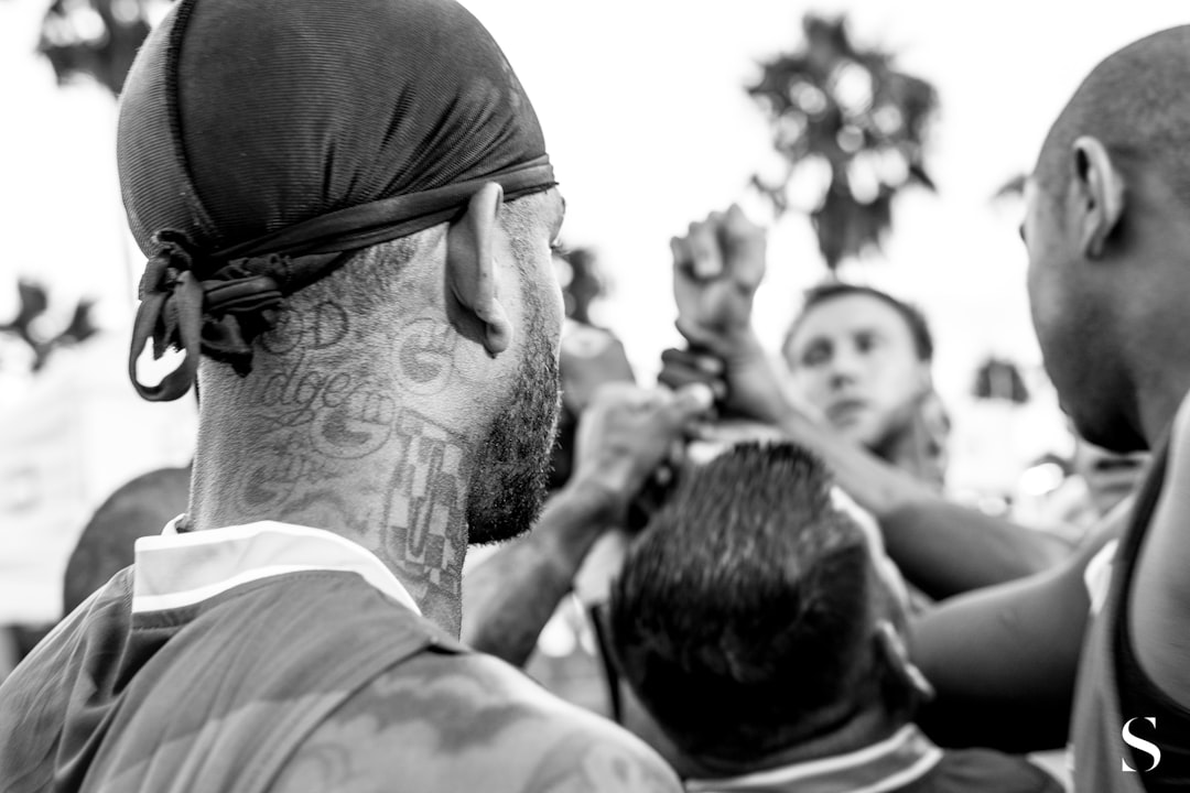 grayscale photo of man in white shirt