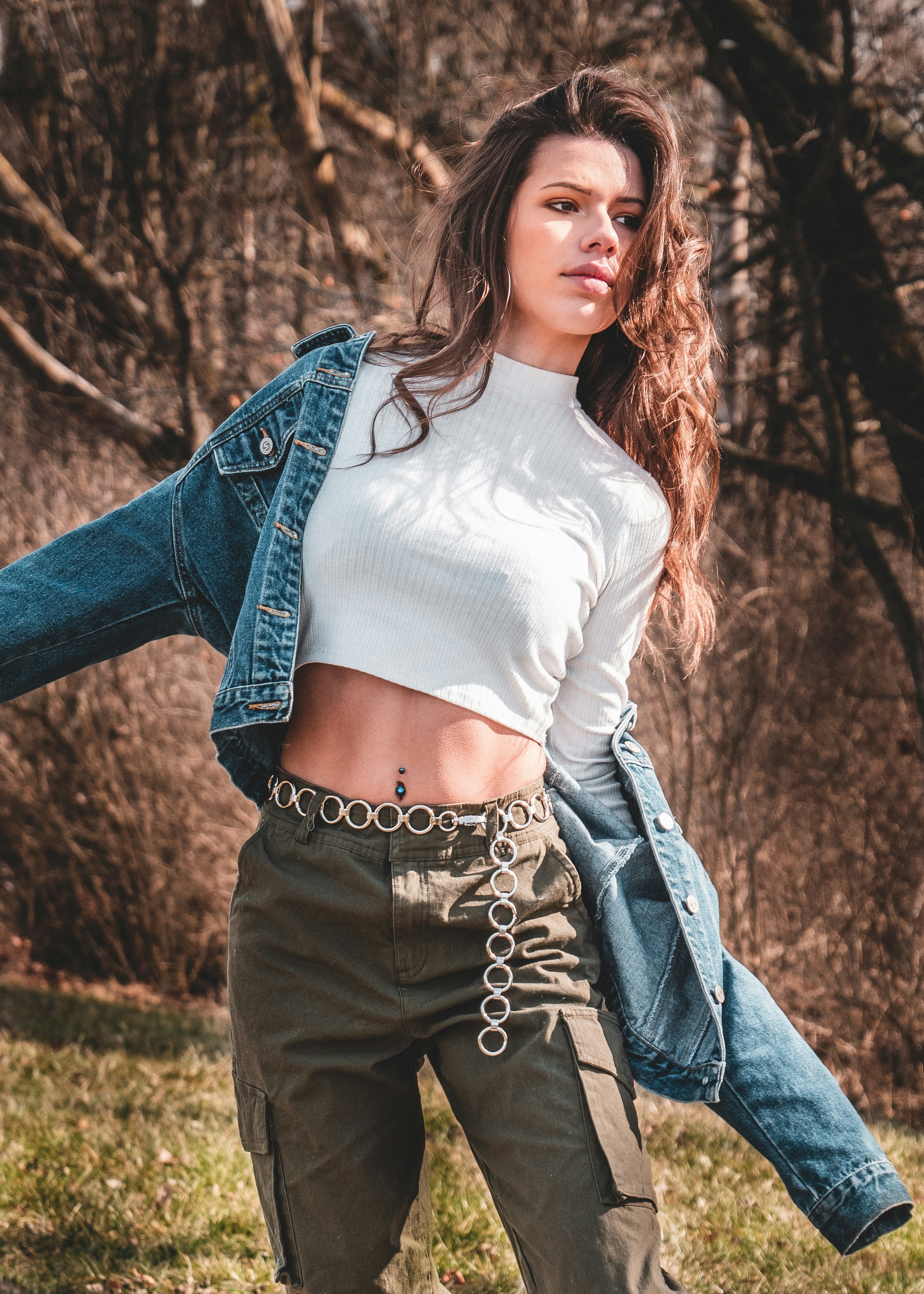 woman in blue denim jeans and white long sleeve shirt