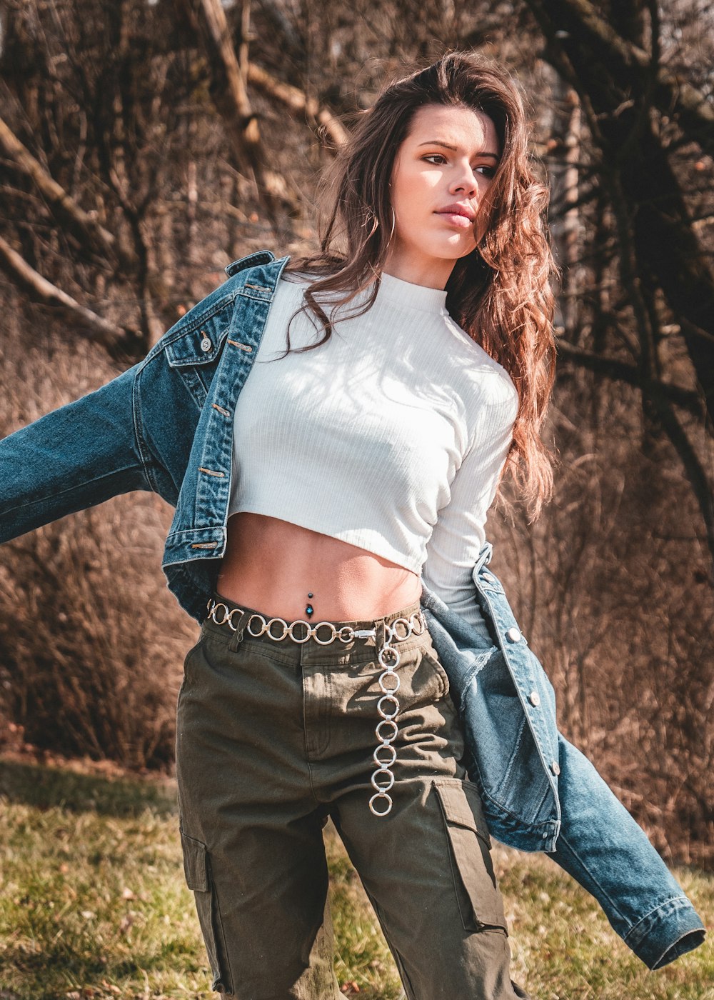 woman in blue denim jeans and white long sleeve shirt