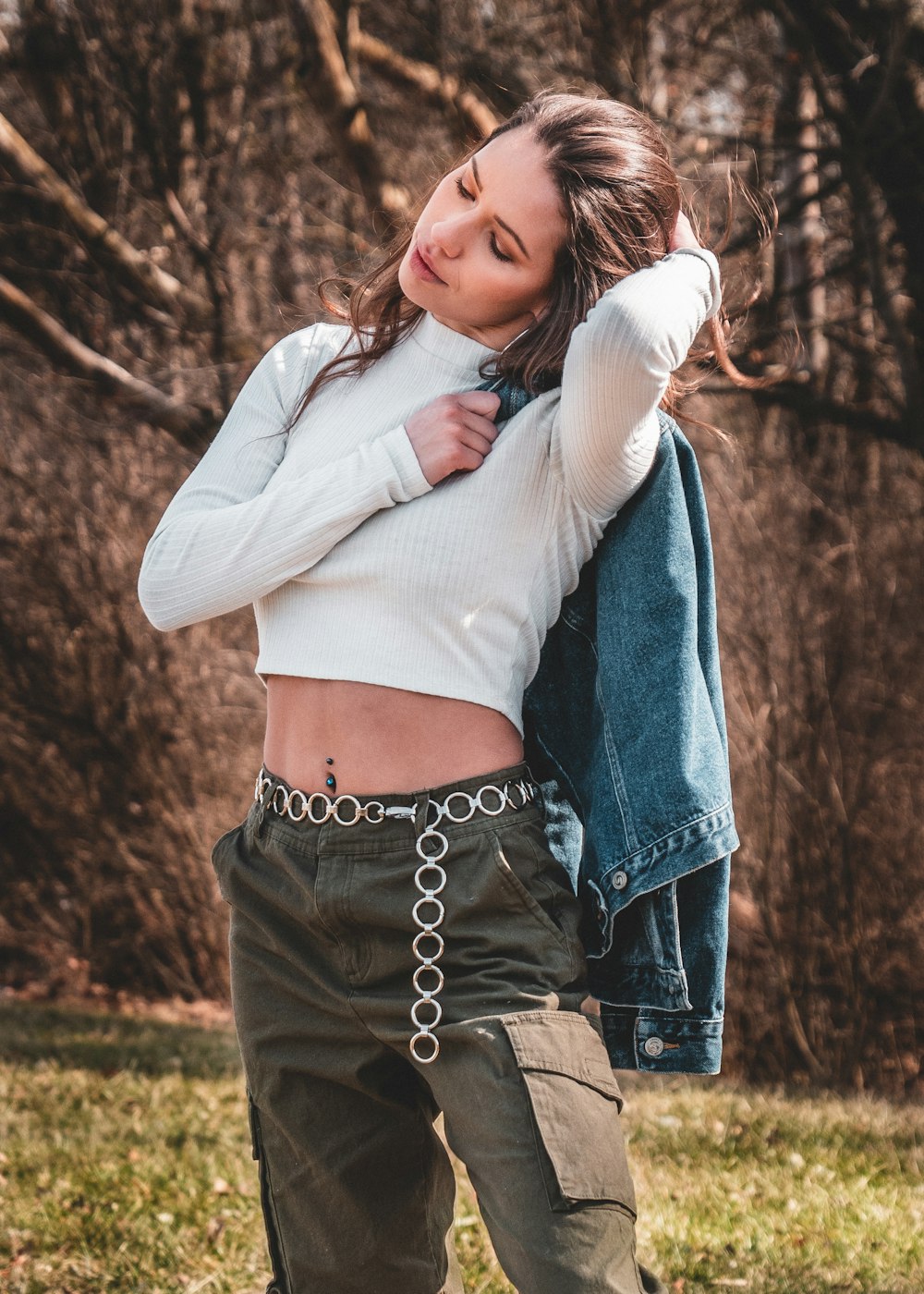 woman in white long sleeve shirt and blue denim jeans