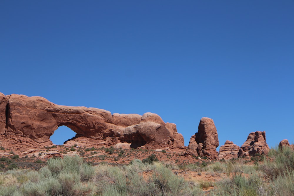 brown rock formation under blue sky during daytime