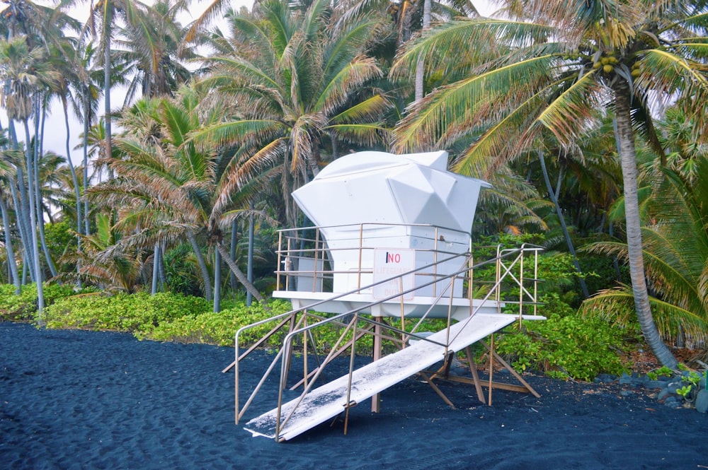 white wooden boat on body of water during daytime