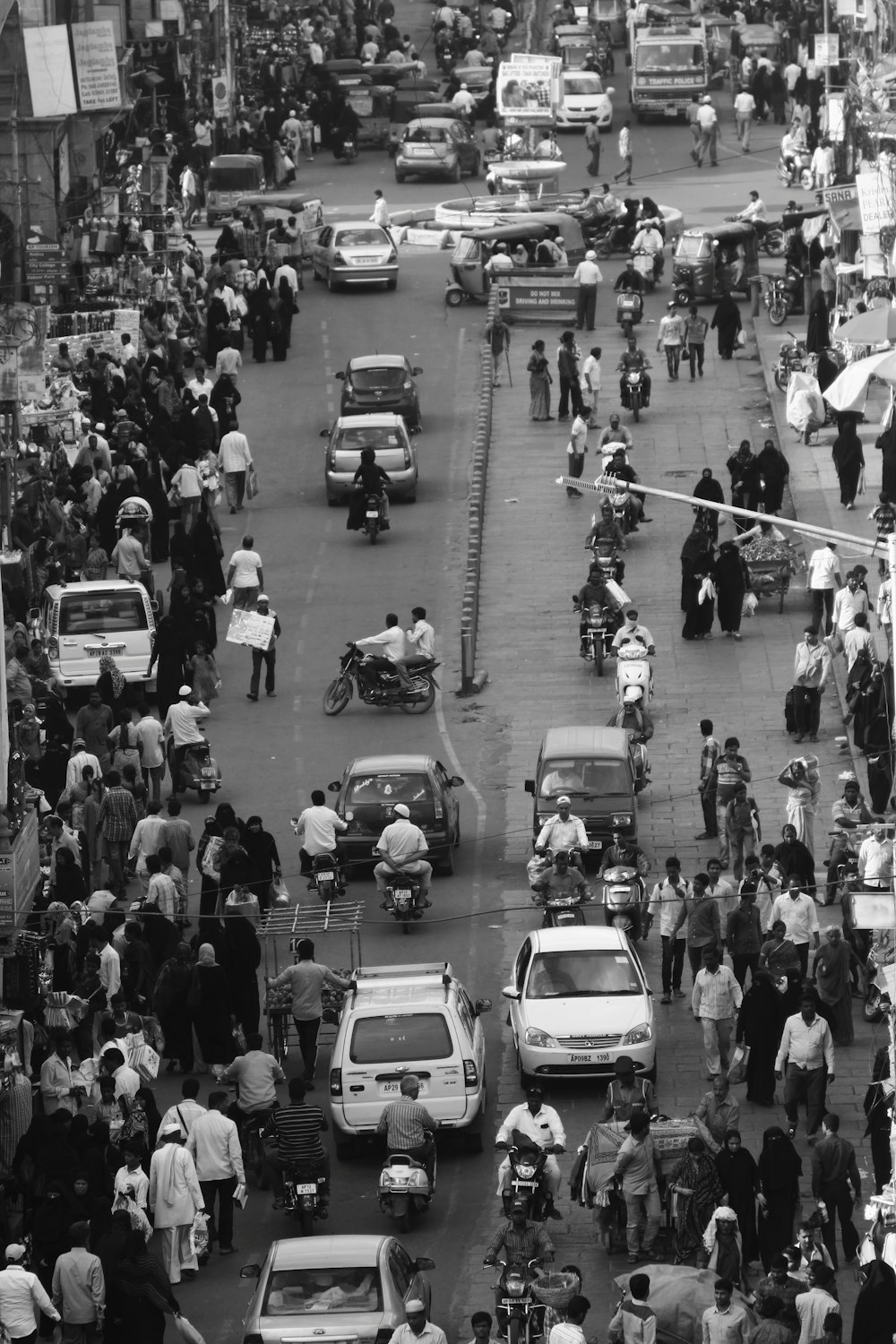 grayscale photo of cars on road