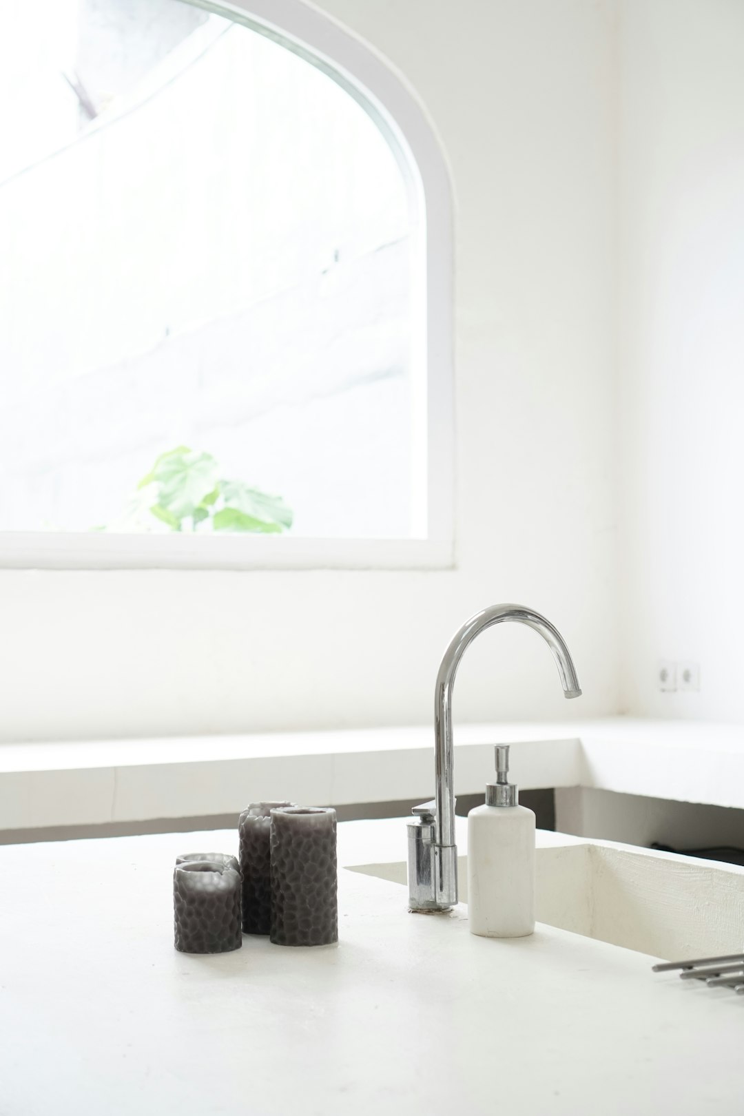 white ceramic sink with faucet