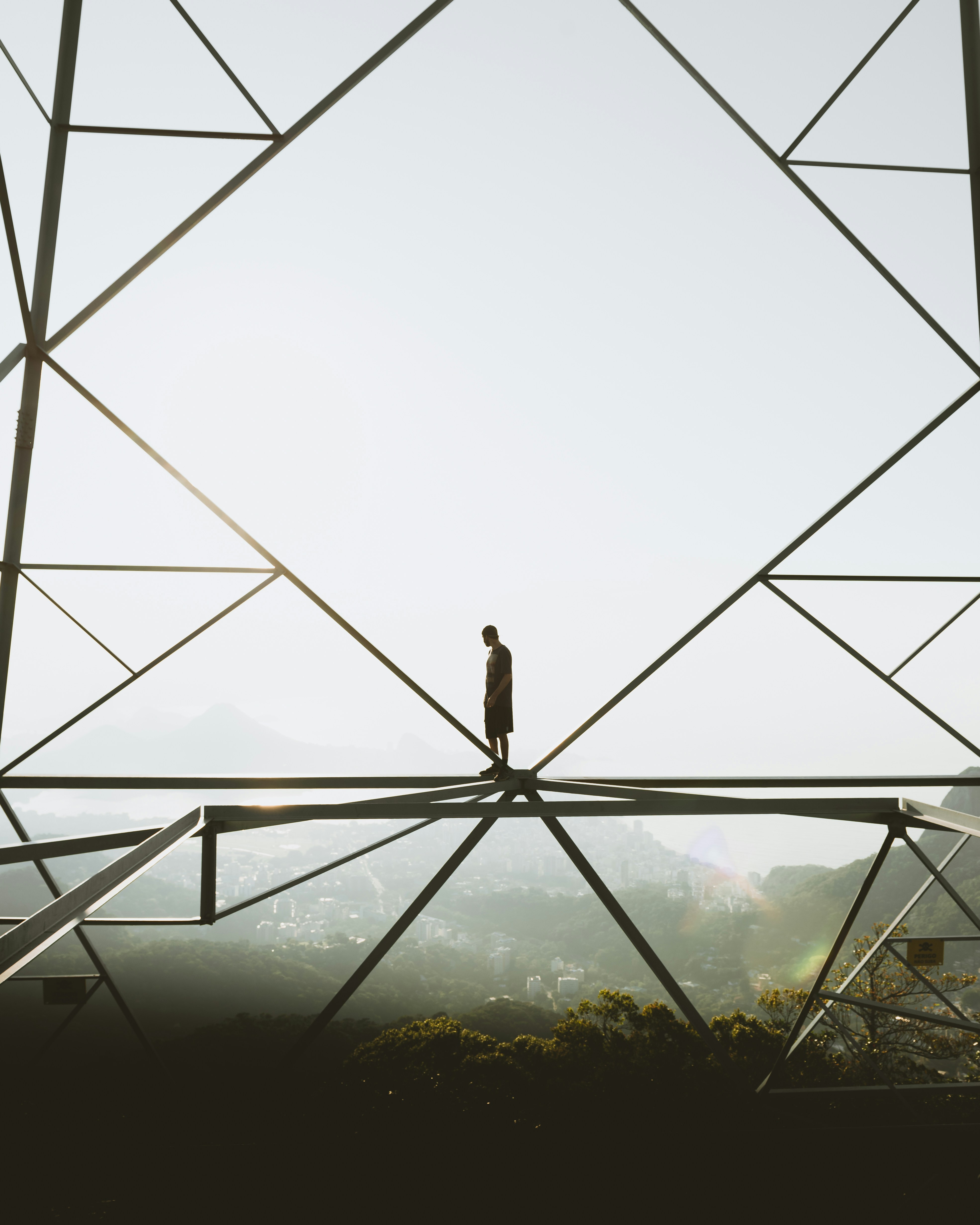 silhouette of person standing on top of building