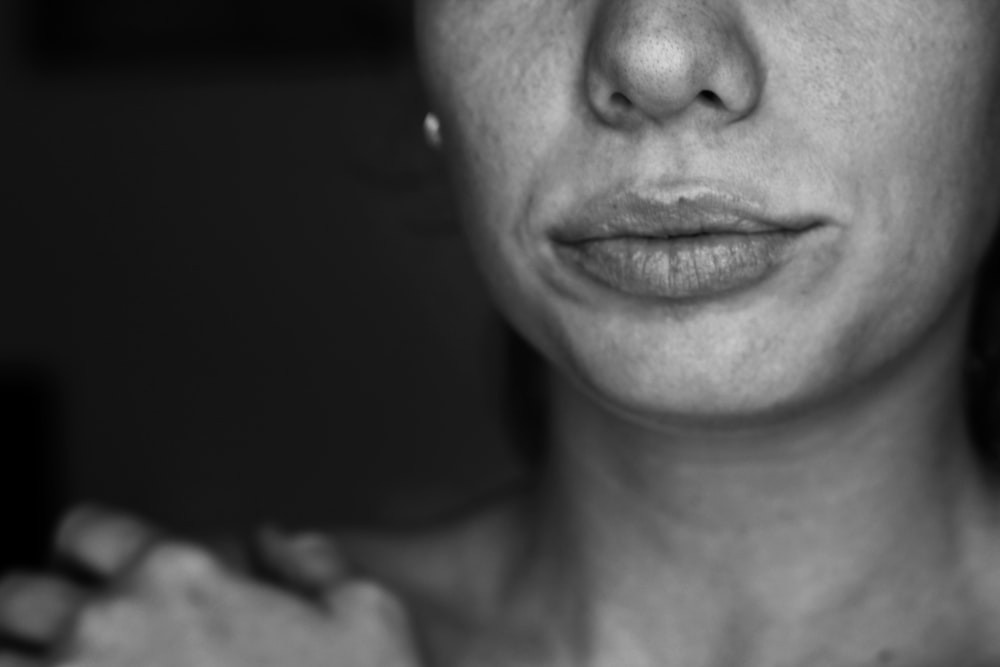 grayscale photo of womans face