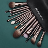 a black case filled with lots of makeup brushes