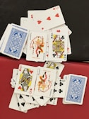 A colorful spread of greedy hands cards laid out, showing a mix of assets and points.