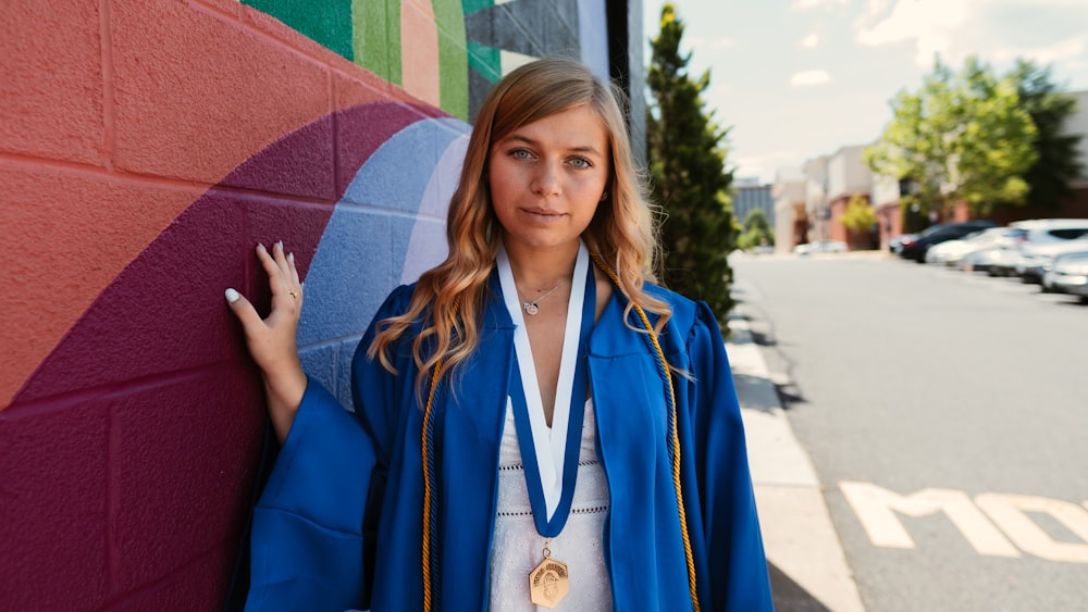 woman in blue and white academic dress