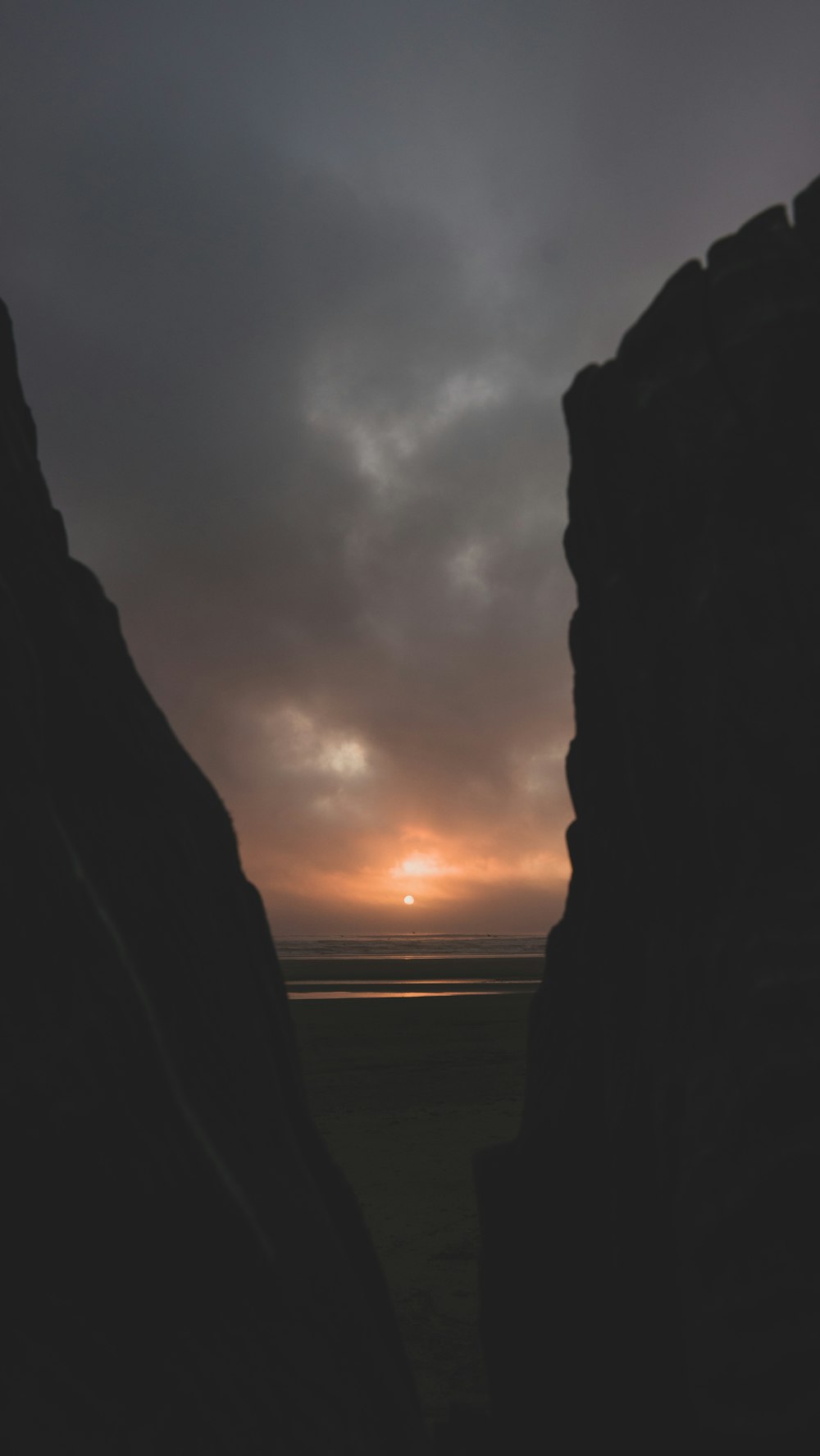 silhouette of rock formation during sunset