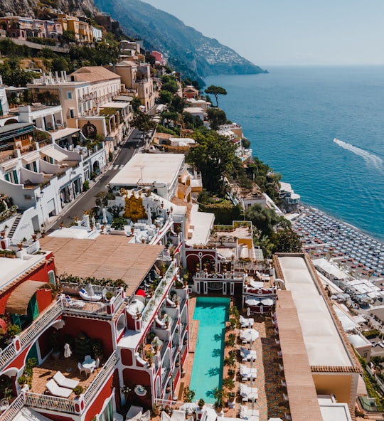 aerial view of city near body of water during daytime in Positano Italy