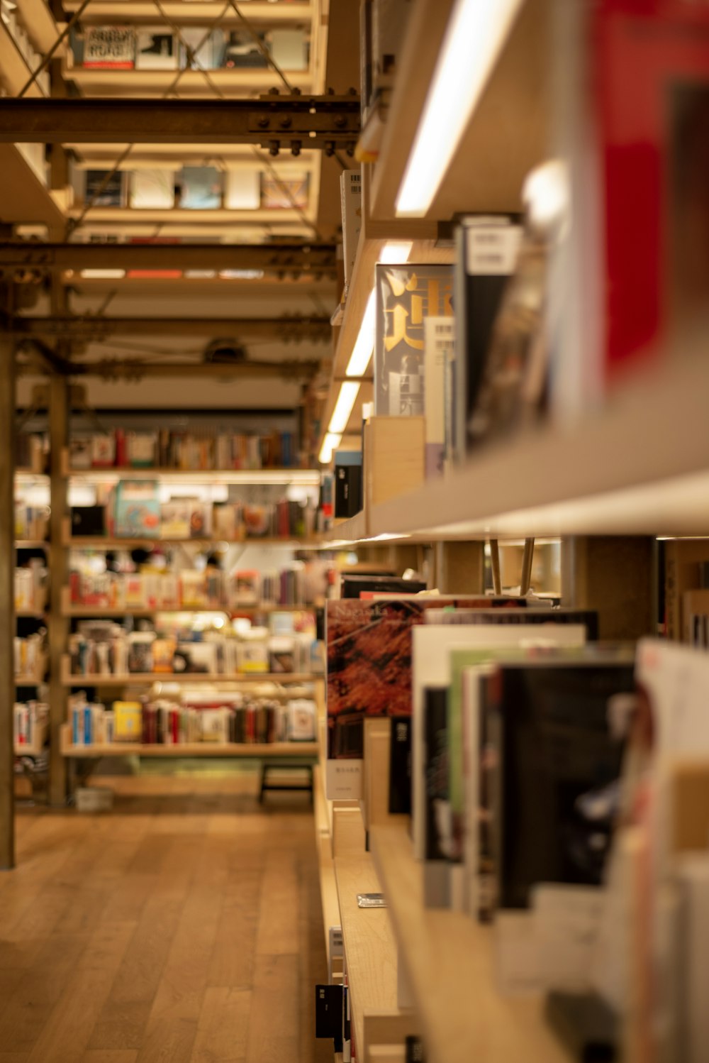 brown wooden shelf with books