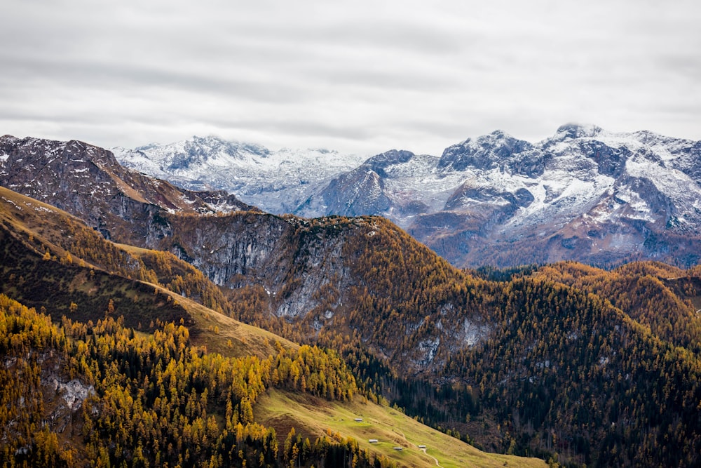 green and brown mountains under white clouds during daytime