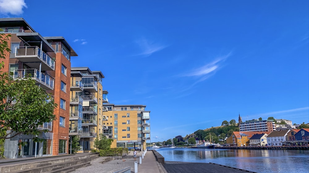 brown concrete building near body of water during daytime