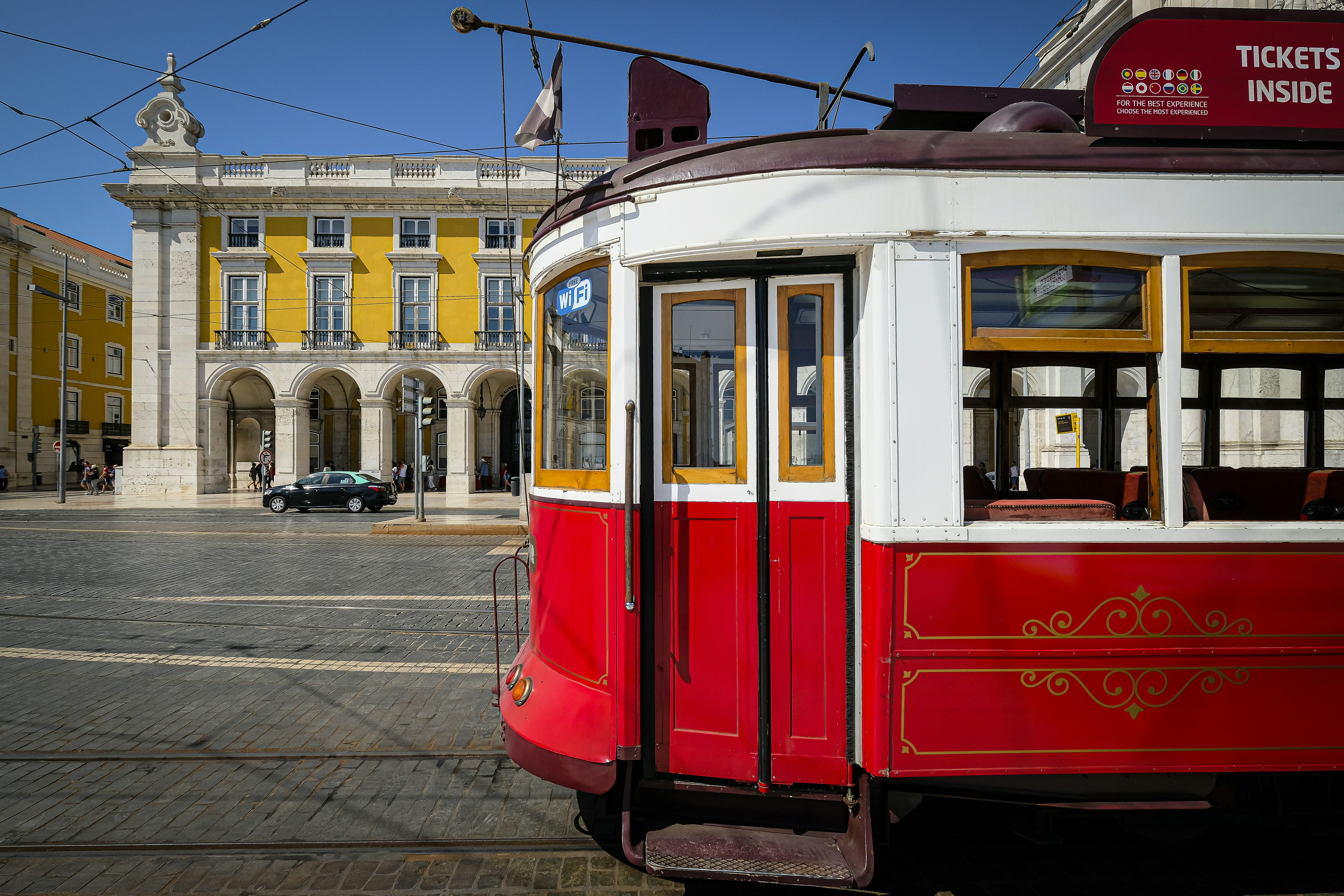 red and white tram on the street